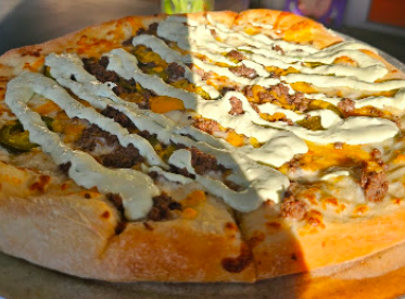 Lola's Pizza signature dishes Pan-Seared Fresh Mozzarella
Spicy Shrimp Sausage Pizza
Steak & Cheese Pizza